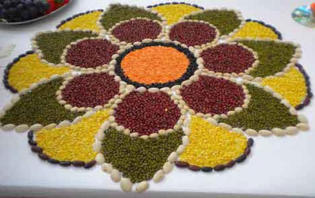 Rangoli With Rice, Pulses And Picture