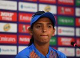 Harmanpreet Kaur surrounded by