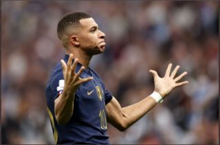 Kylian Mbappe beats Lionel Messi to